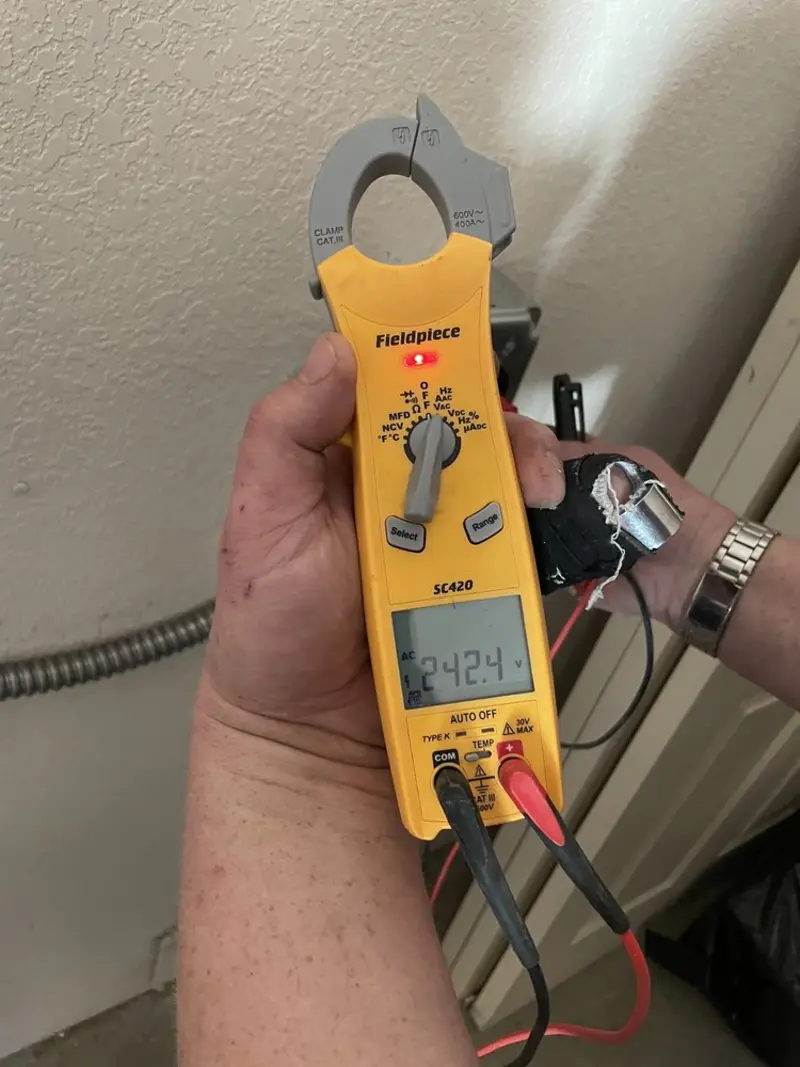 Voltage testing with clamp meter during Generator Installation in Merritt Island